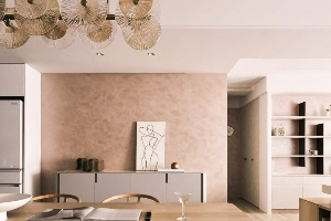 Modern interior with a soft pink lime-based textured wall, wooden furniture, and elegant decor.
