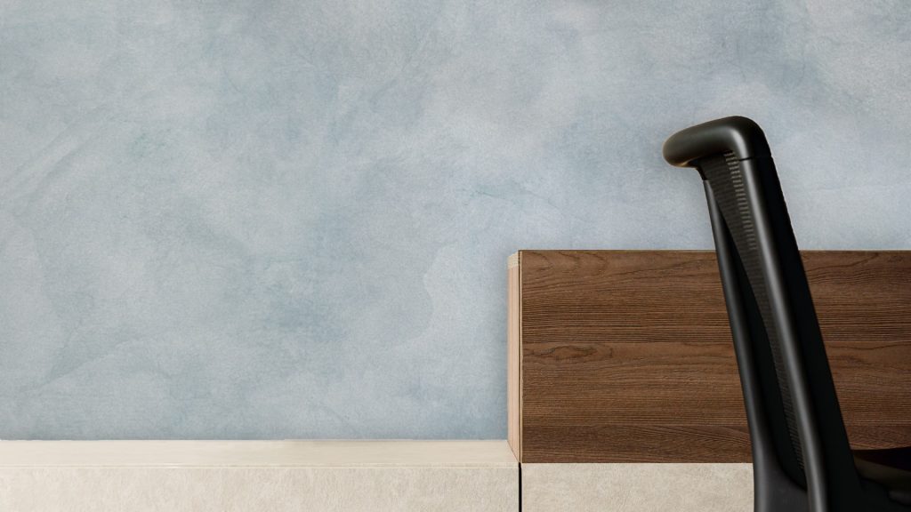 Minimalistic Office Space with Blue Wall and Wooden Cabinet