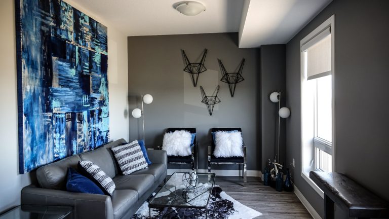 Modern Living Room with Blue Art and Geometric Wall Decor