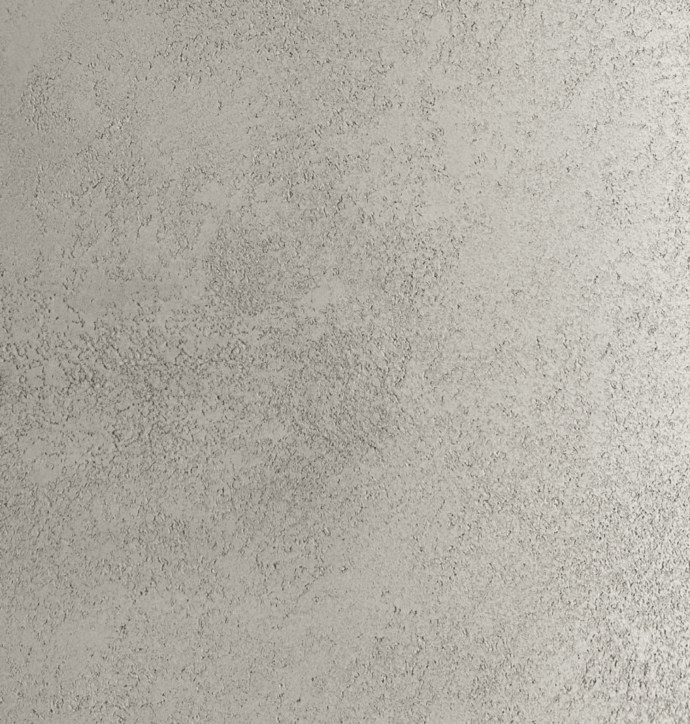 Textured lime-based wall with a soft grey finish
