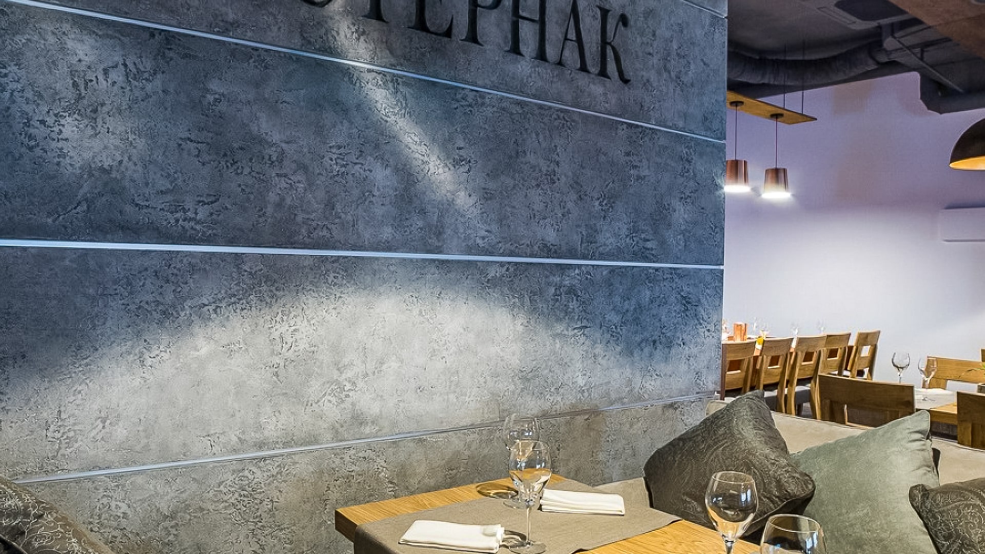 Restaurant interior featuring elegant textured lime-based wall finishes, perfect for specialty contractors' projects.