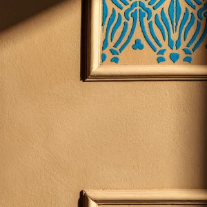 Close-up of matte limewash paint applied to a wall, showcasing its soft, chalky texture and natural mineral variations