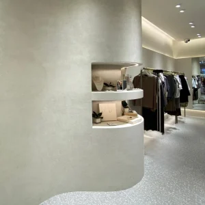 Curved retail walls with Teseo Travertine Finish marble glow lime plaster by Decora A&C