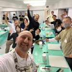 Happy students raise their arms in celebration during a fun, hands-on workshop at Decora Academy.