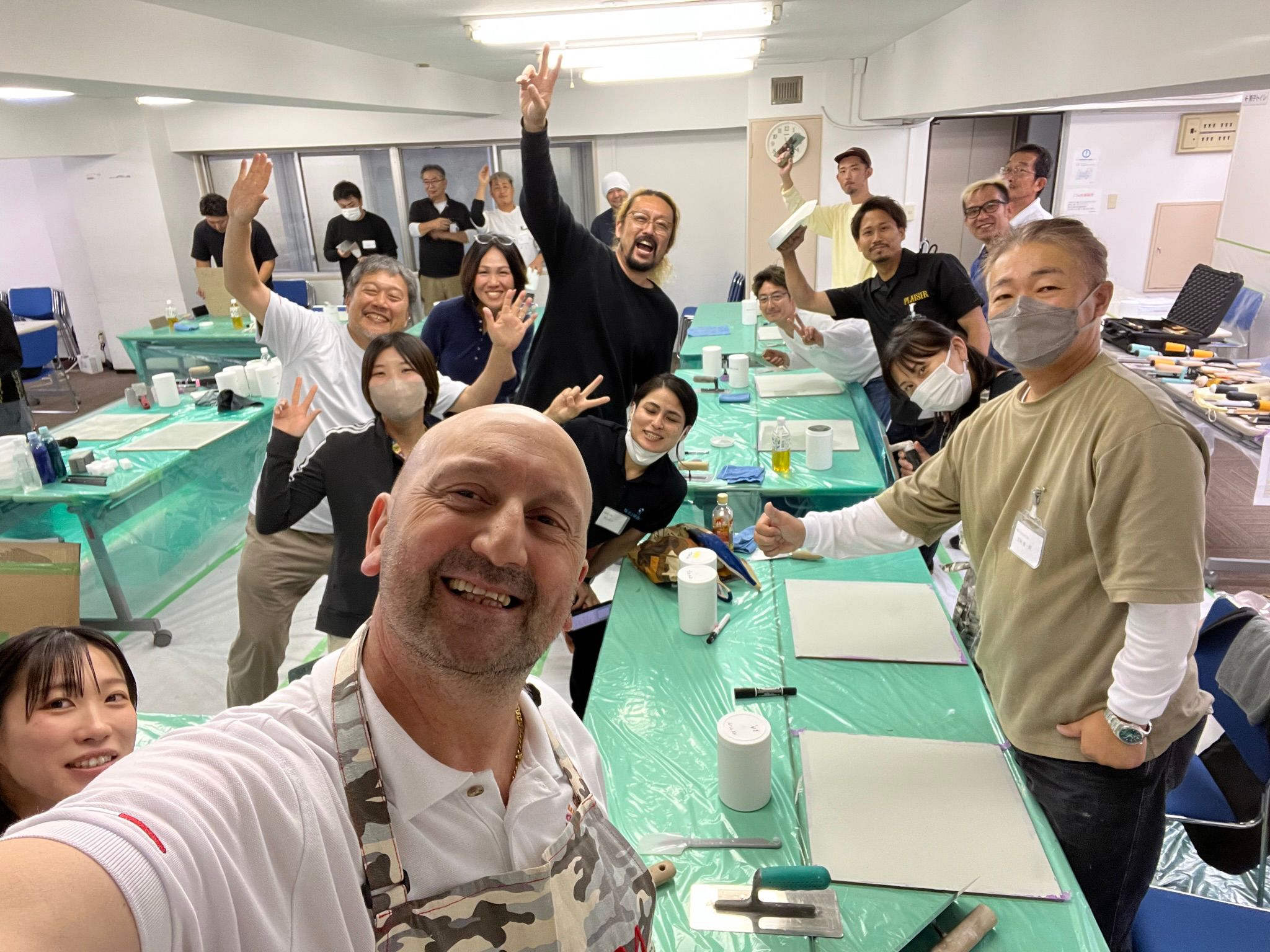 Happy students raise their arms in celebration during a fun, hands-on workshop at Decora Academy.