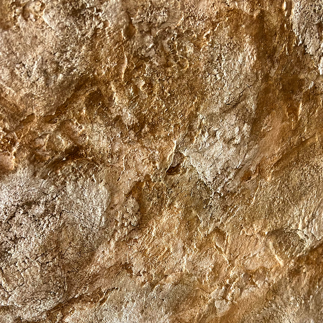Close-up of PETRA textured fibrous slaked lime finish with stone-like depth and natural mineral variation.