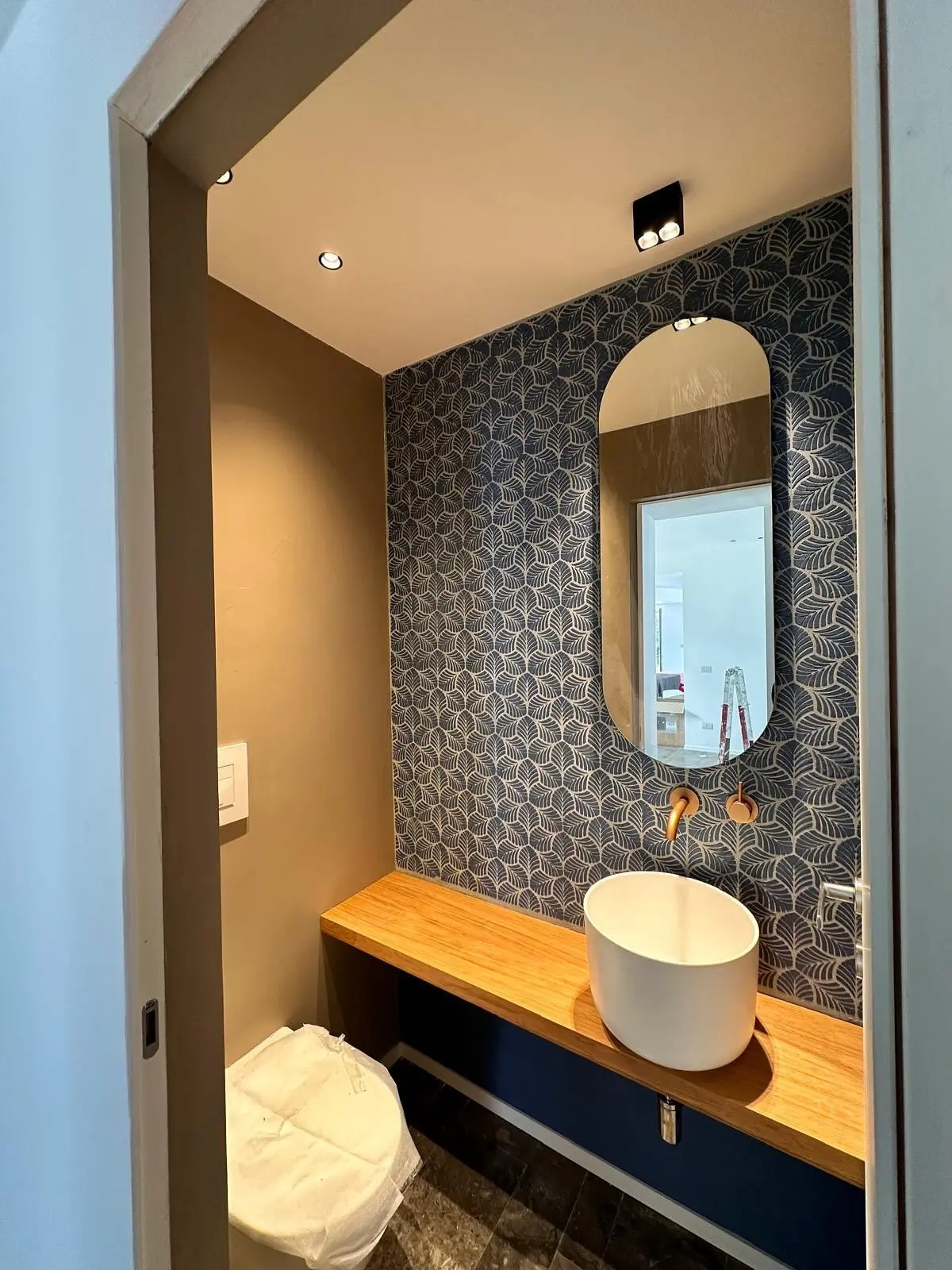 Contemporary bathroom featuring Italian diamond stencil wall art, enhanced with breathable mineral coatings and luxury Sicilian craftsmanship.