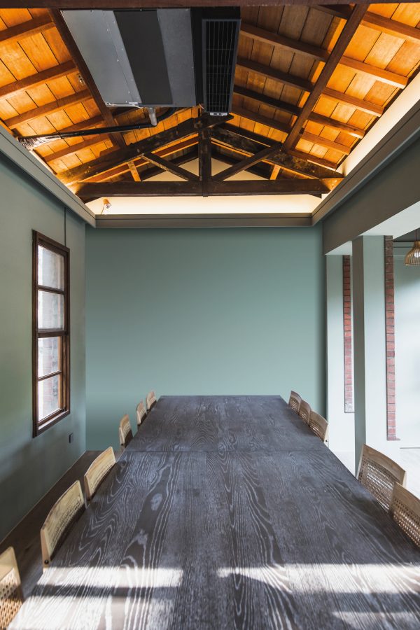 Modern Meeting Room with Wooden Table and Carrara Semi-Gloss Green Wall Finish